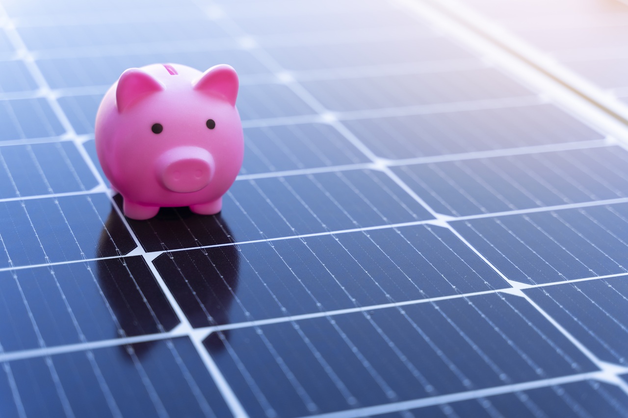 Piggy bank on a solar panel