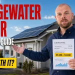 Ray-style solar advisor holding an electricity bill beside a Bridgewater home with rooftop solar panels
